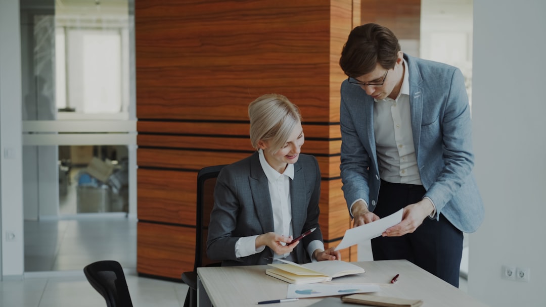 Business professionals discussing strategy. Photo by Vitaly Gariev on Unsplash.