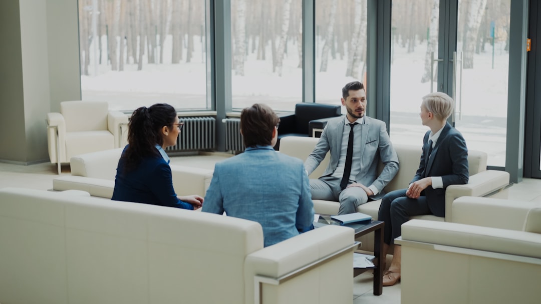 Business leaders in a strategy discussion. Photo by Vitaly Gariev on Unsplash.